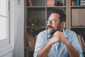 A man thinking about a medication-assisted treatment program