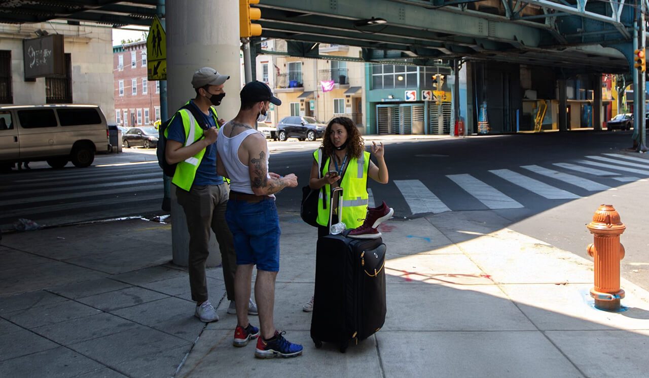 People helping man in kensington